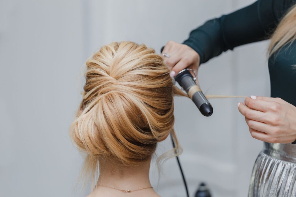 Formal Hairstyles 3 hair stylist finishes an updo